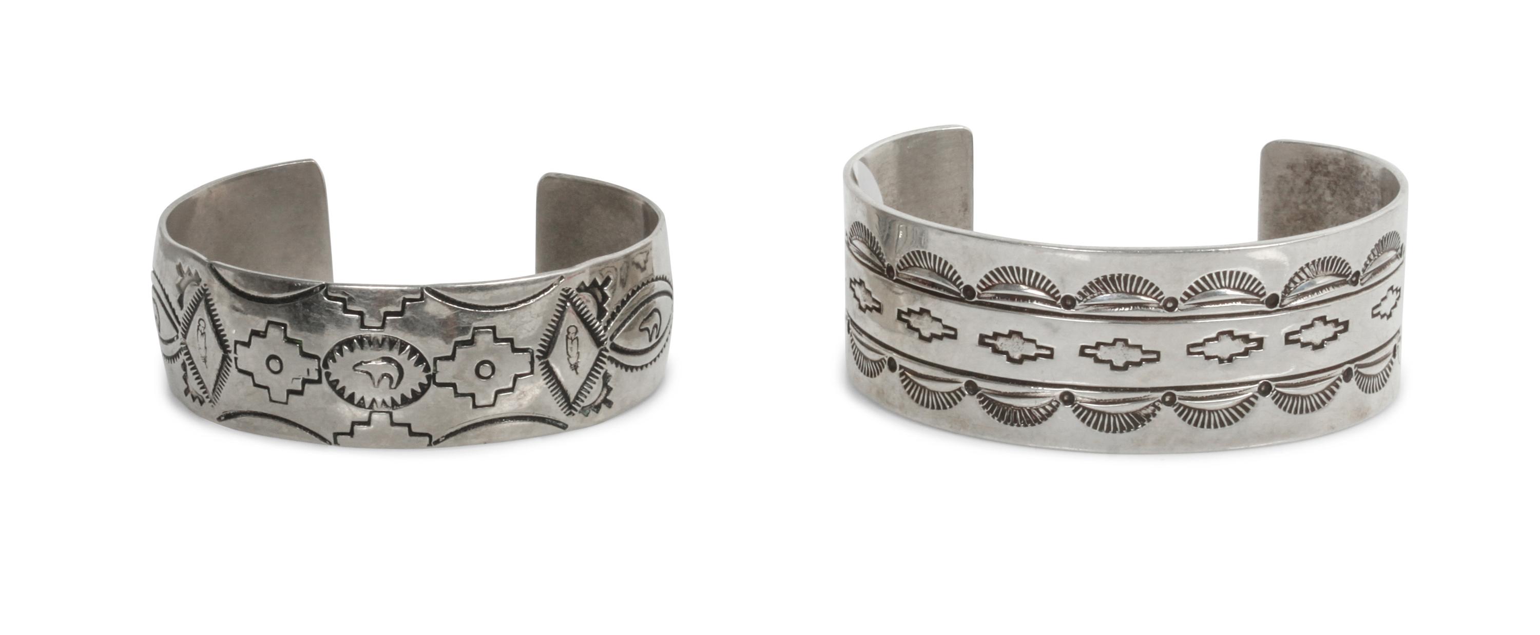 Two Traditional Style Navajo Stamped Silver Bracelets Length of larger 5 5/8 x opening 1 3/8 x width 1 inches.