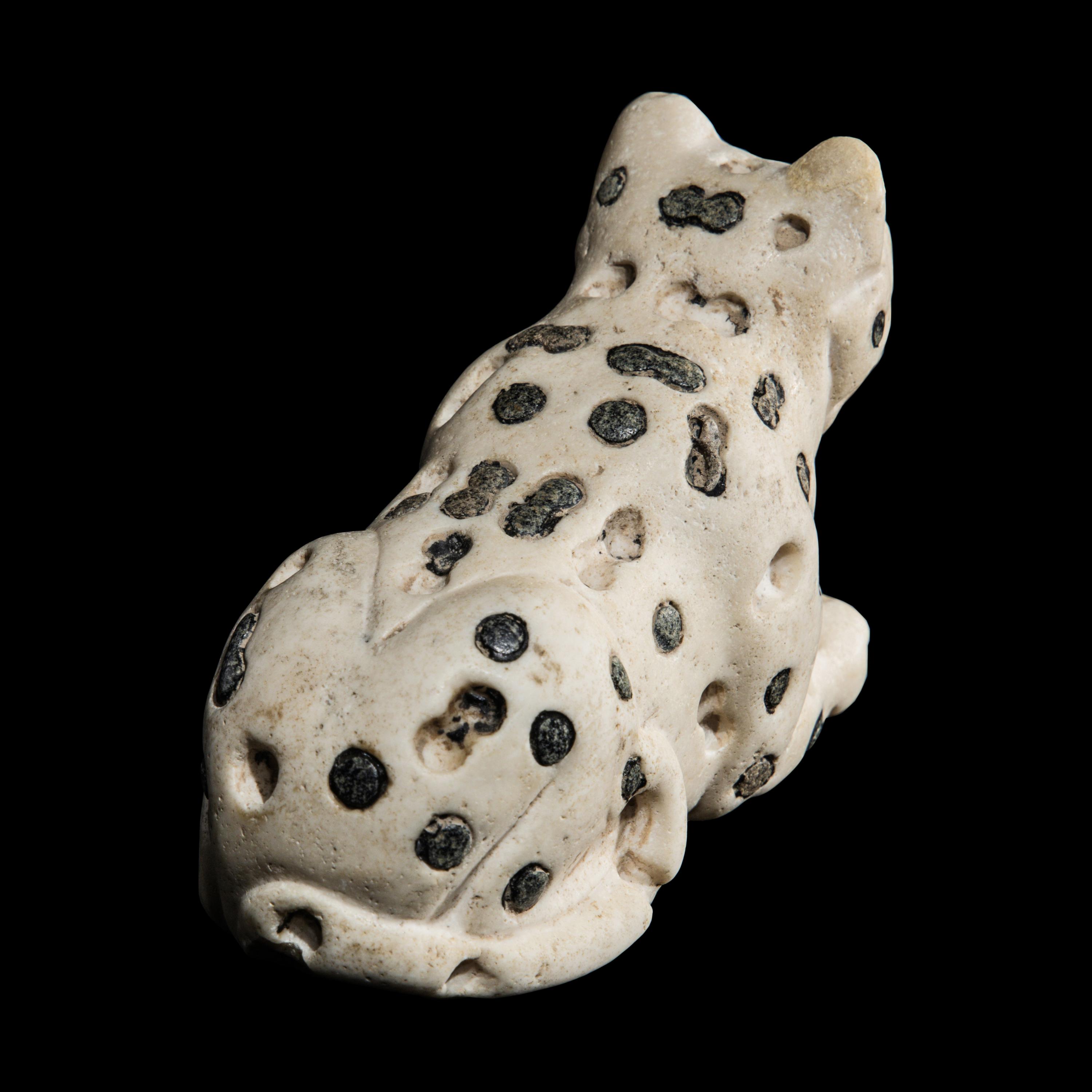 A Mesopotamian Marble and Lapis Lazuli Recumbent Leopard