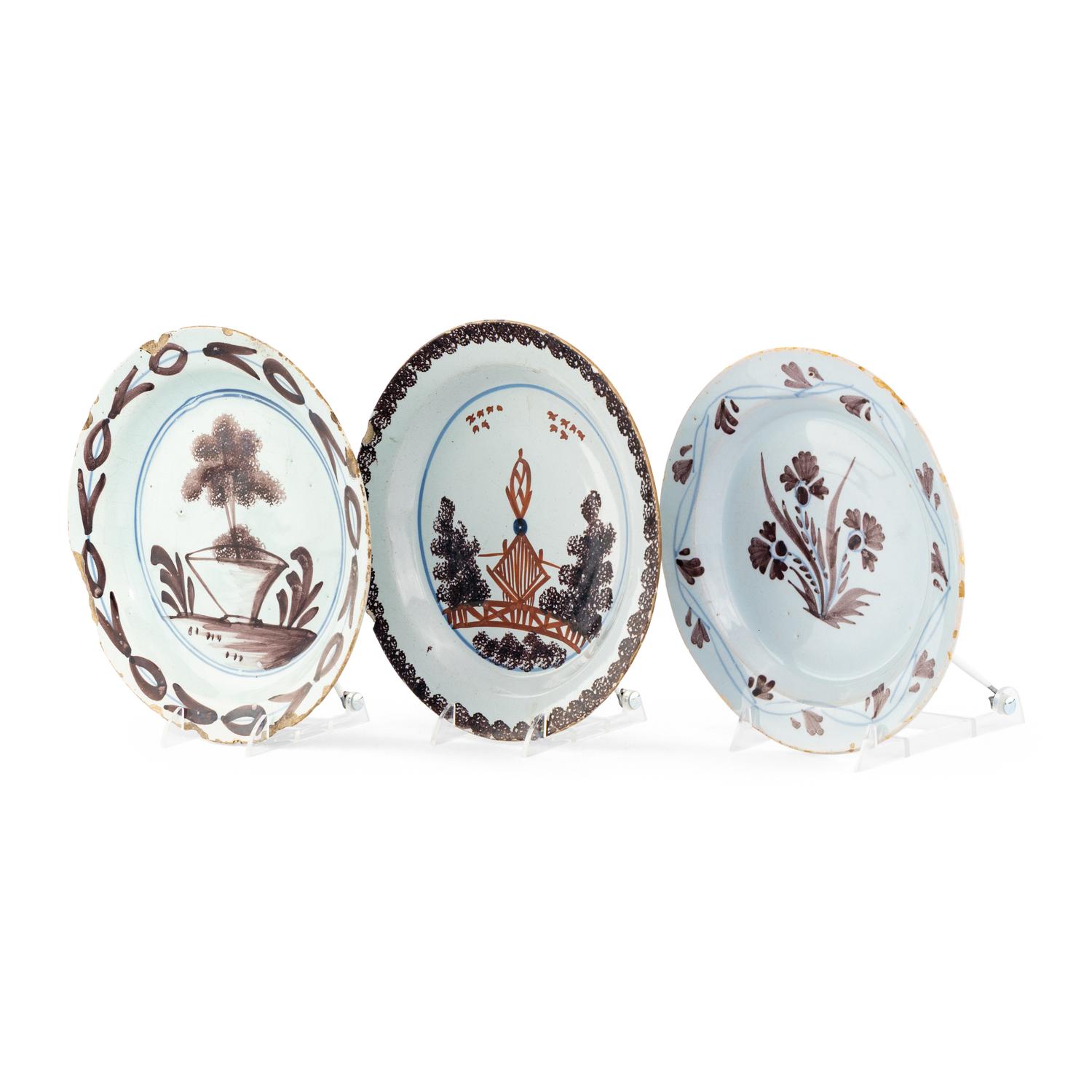 A Collection of Three English Manganese Decorated Delftware Plates