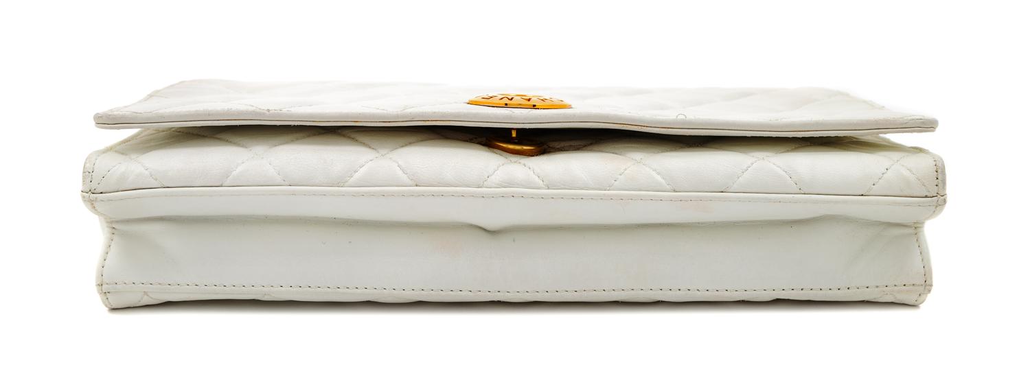 A Chanel White Lambskin Flap Clutch/Bag, 7" H x 10" W x 2" D; Strap drop: 17".