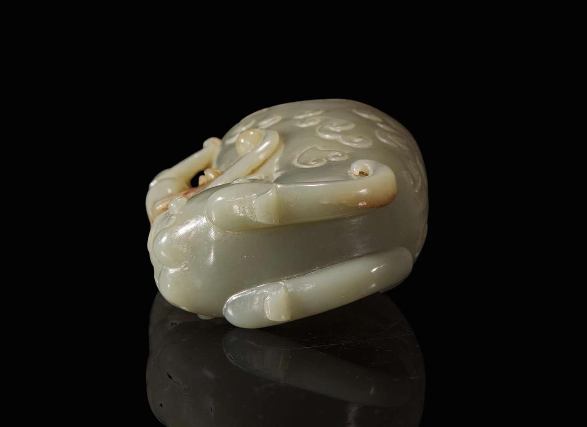 A Chinese carved celadon jade rhyton 玉爵杯