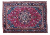 An Oriental Wool Rug 10 feet 10 1/2 inches x 8 feet.