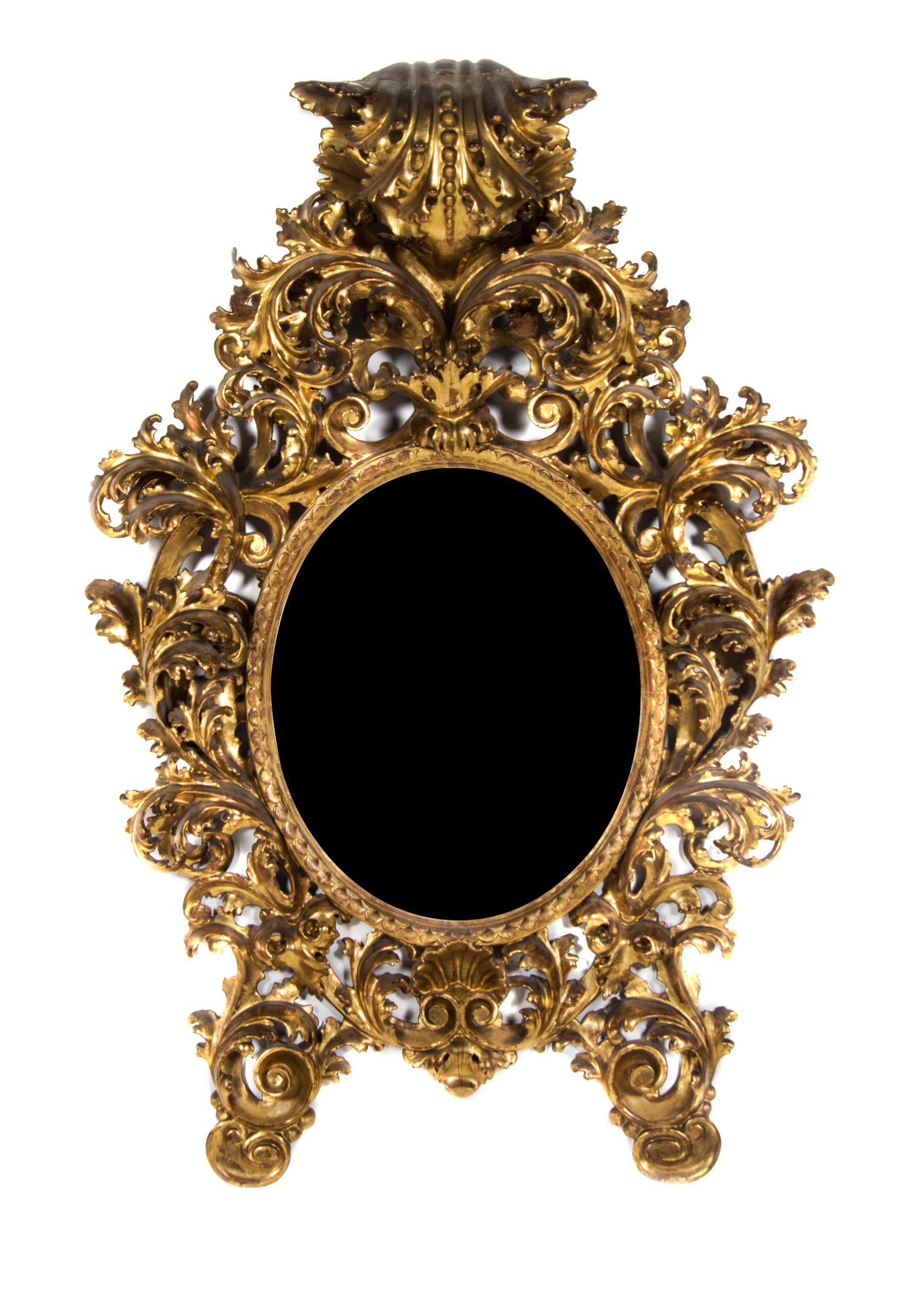 An Italian Rococo Giltwood Pier Mirror, Height 57 x width 38 inches.
