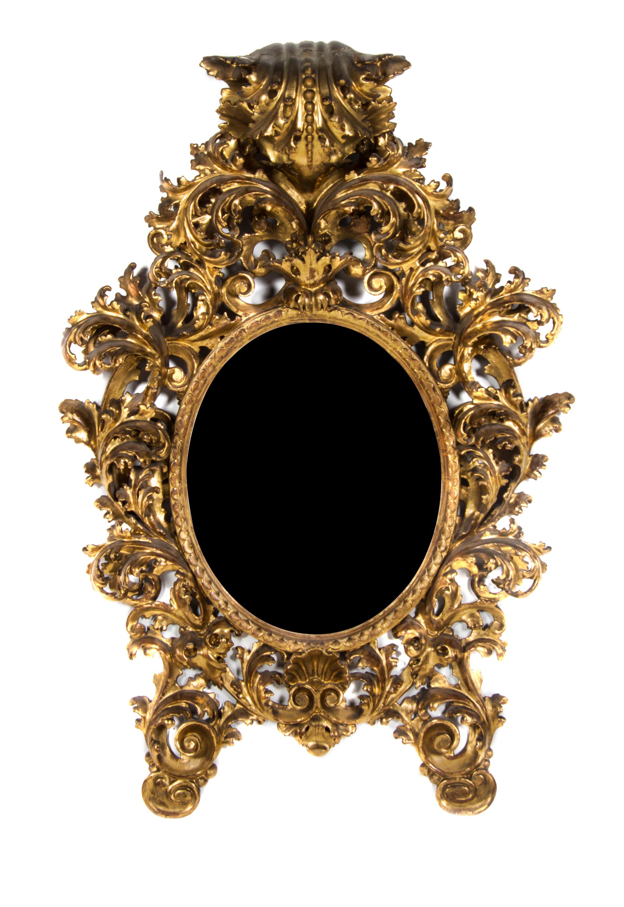 An Italian Rococo Giltwood Pier Mirror, Height 57 x width 38 inches.