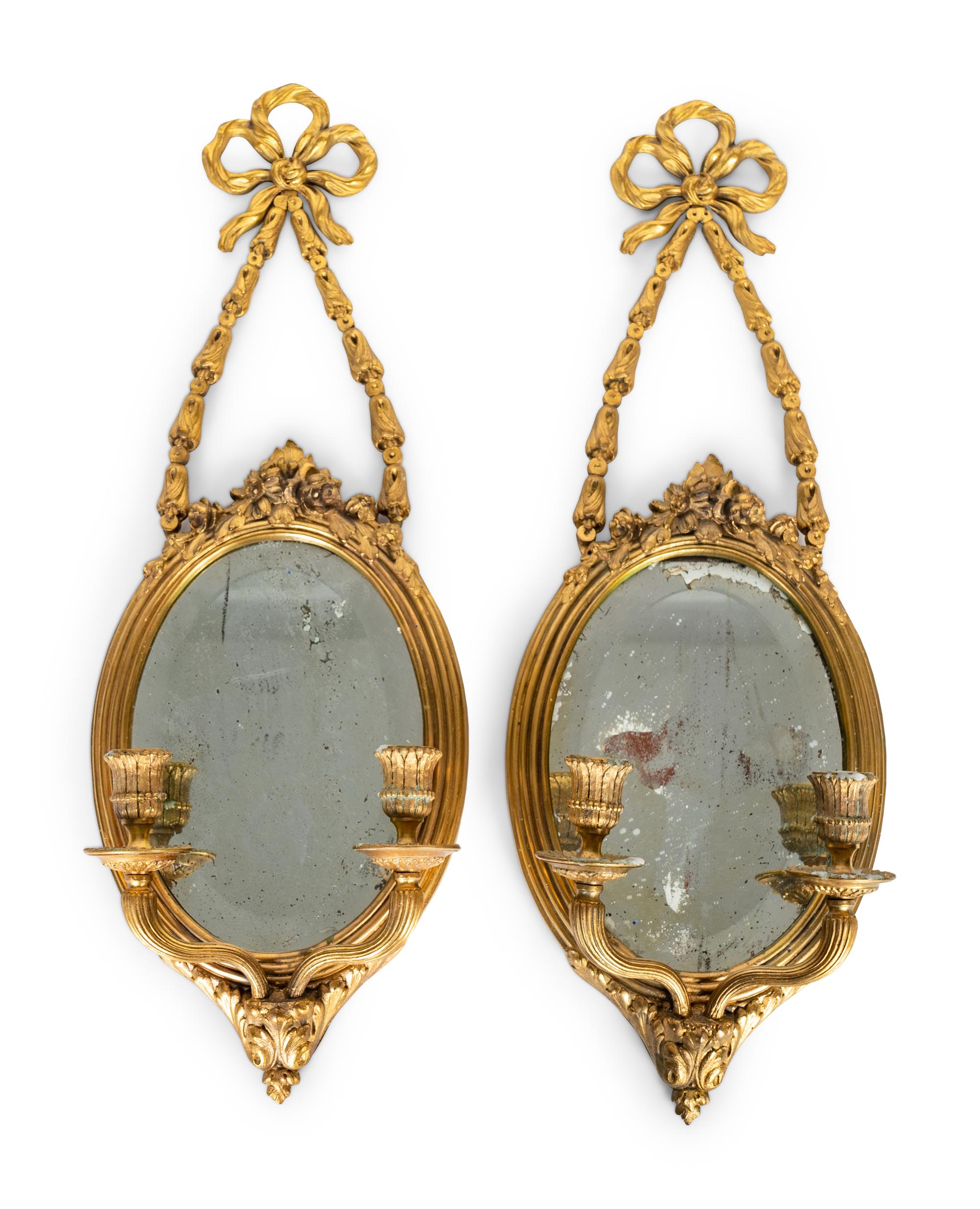 A Pair of Louis XVI Style Gilt-Metal and Beveled Glass Two Light Sconces — 20TH CENTURY