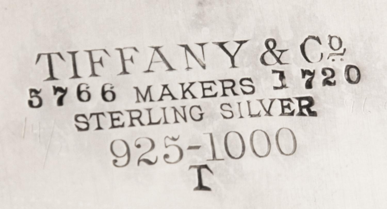 An American Silver Salver, Tiffany & Co., New York, NY, 1880, of circular form, with a foliate scroll border and a script monogram at t