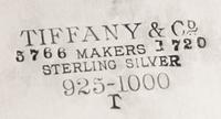 An American Silver Salver, Tiffany & Co., New York, NY, 1880, of circular form, with a foliate scroll border and a script monogram at t