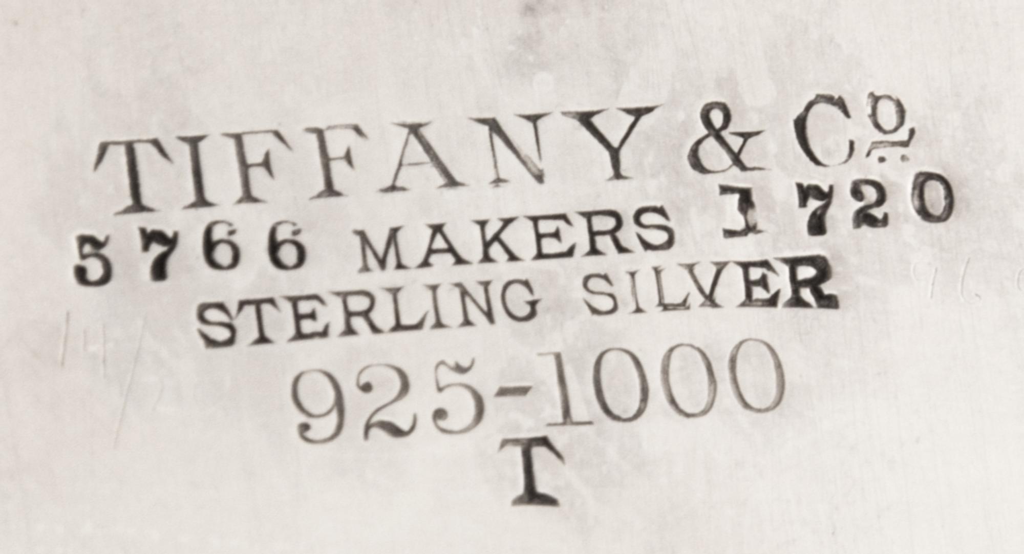 An American Silver Salver, Tiffany & Co., New York, NY, 1880, of circular form, with a foliate scroll border and a script monogram at t