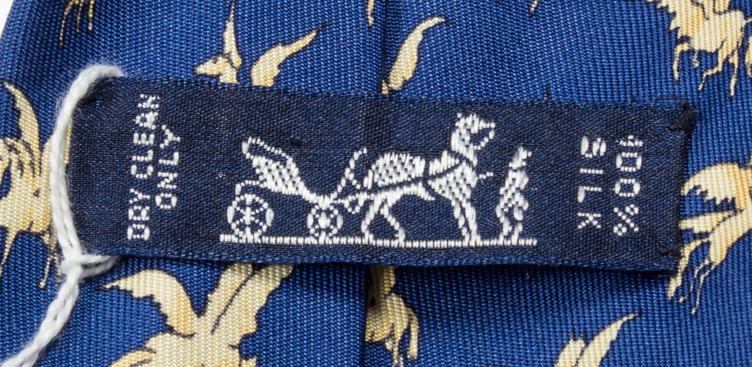 A Group of Three Hermes Silk Ties, 3.15" wide.