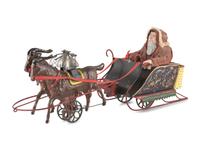 A Bliss Lithograph on Wood Santa on Sleigh and a Santa Claus on a Tin Sleigh