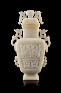 A White Jadeite Covered Vase Height 8 1/2 inches.