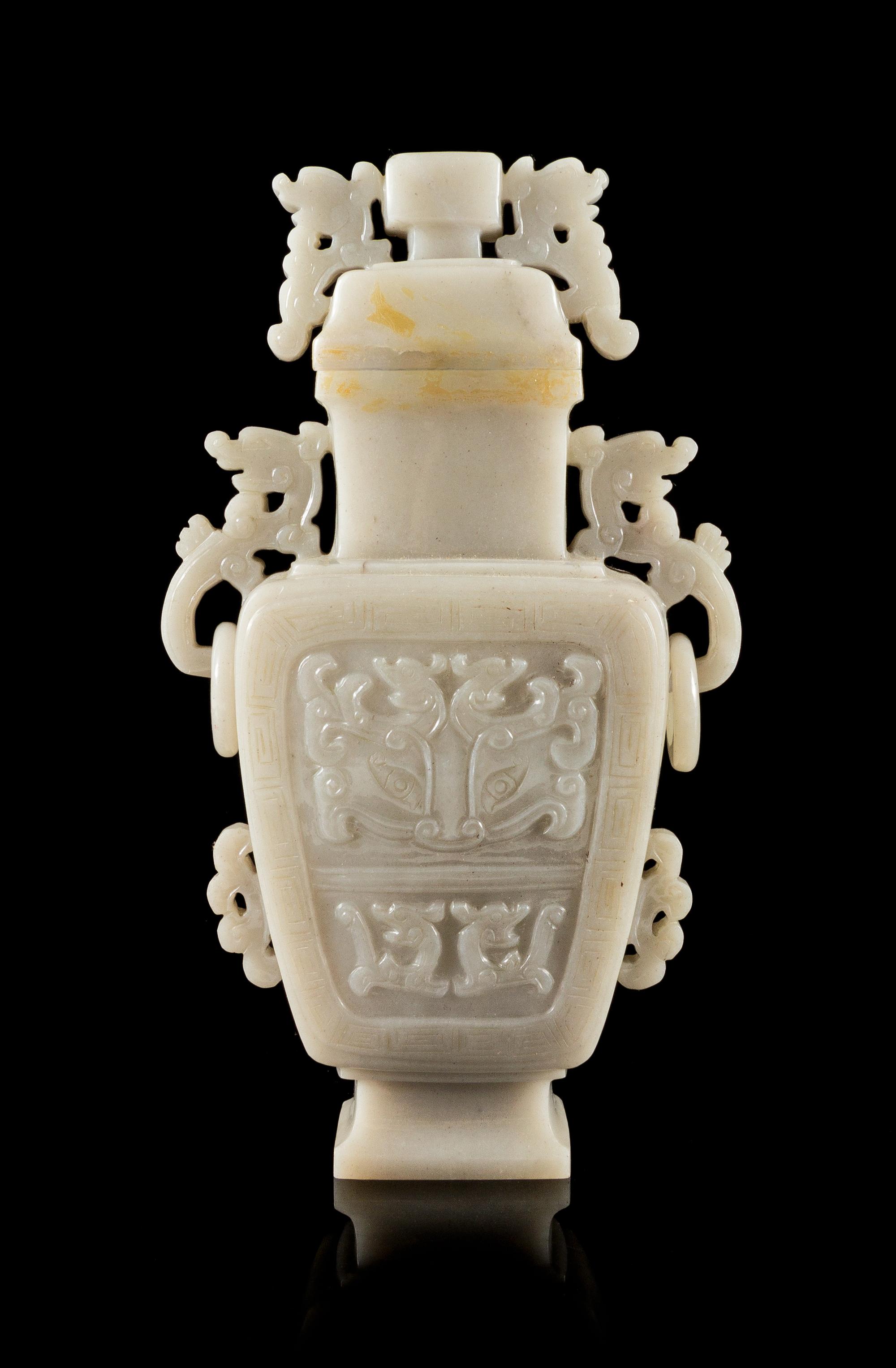 A White Jadeite Covered Vase Height 8 1/2 inches.
