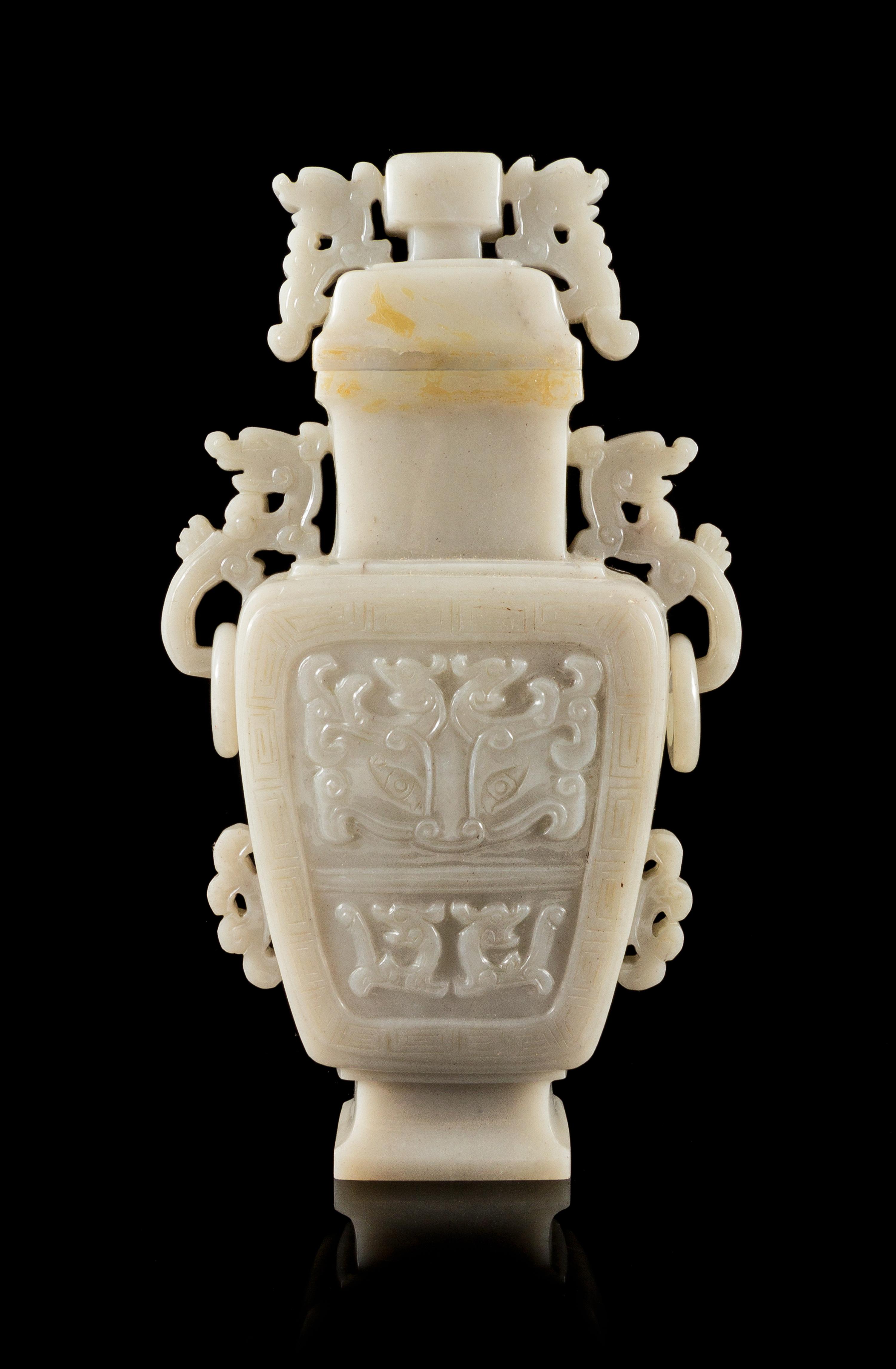 A White Jadeite Covered Vase Height 8 1/2 inches.