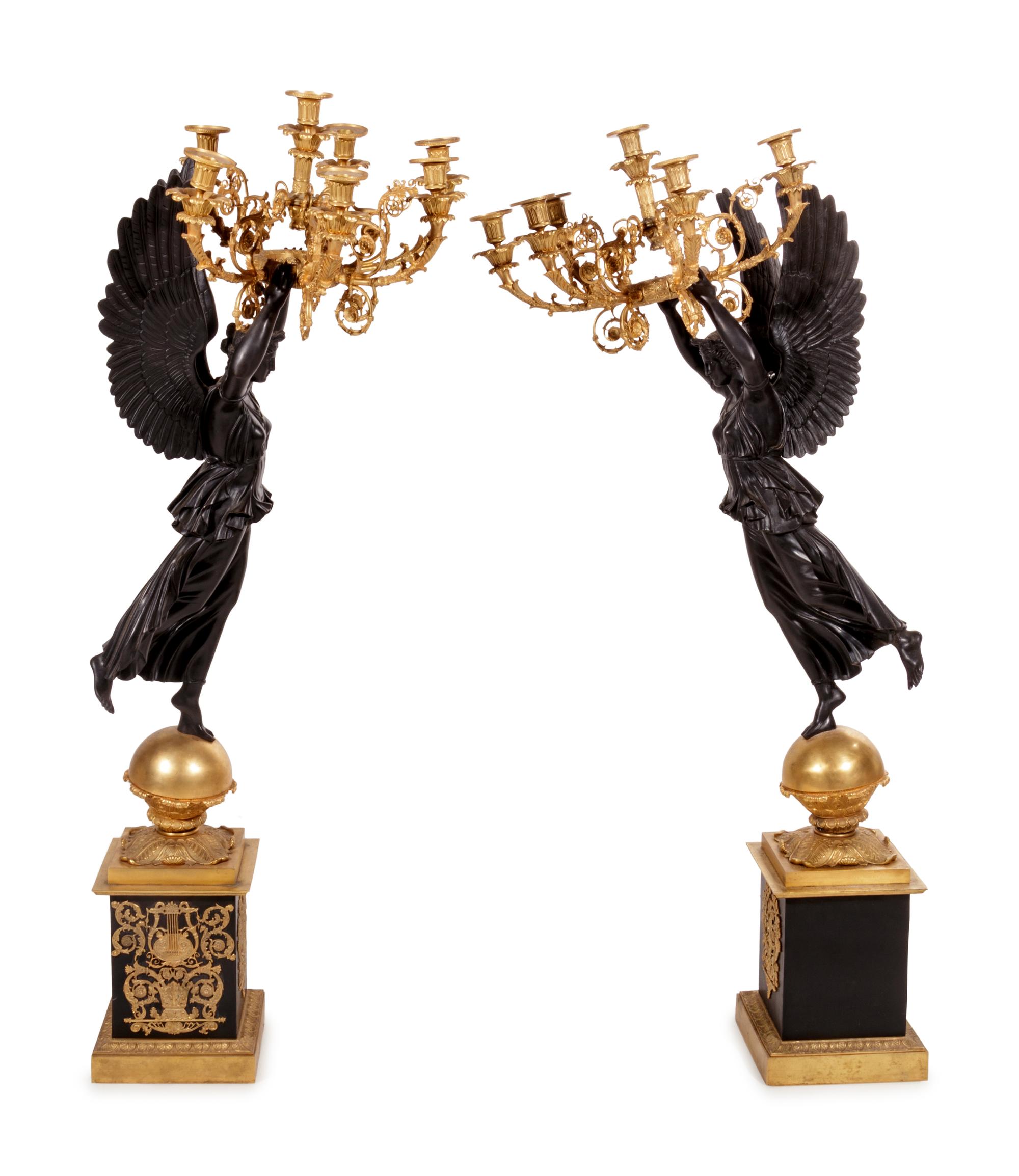 A Pair of Empire Style Gilt and Patinated Cast Metal Seven-Light Torchères