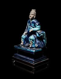 A Chinese Fahua Porcelain Figure of Seated Guardian, Guanyu
