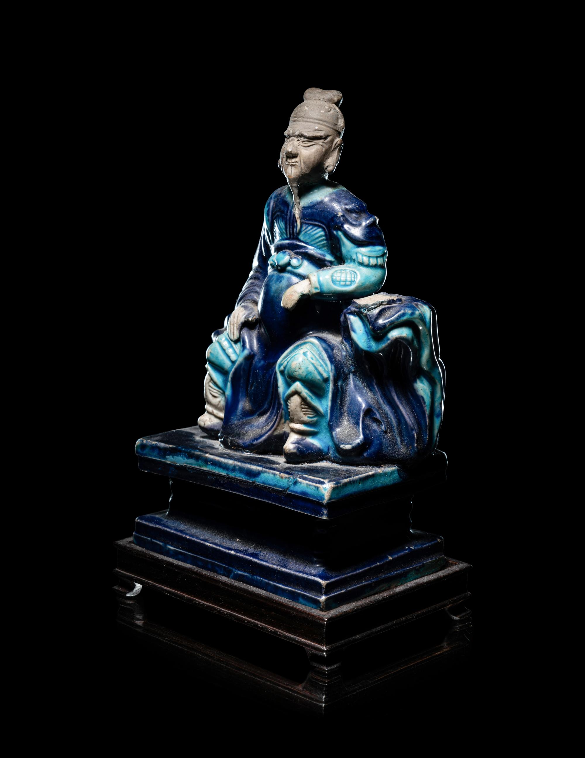 A Chinese Fahua Porcelain Figure of Seated Guardian, Guanyu