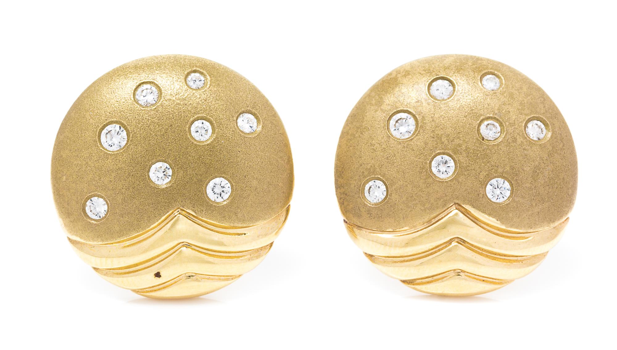 A Pair of 14 Karat Yellow Gold and Diamond Earclips, 8.80 dwts.
