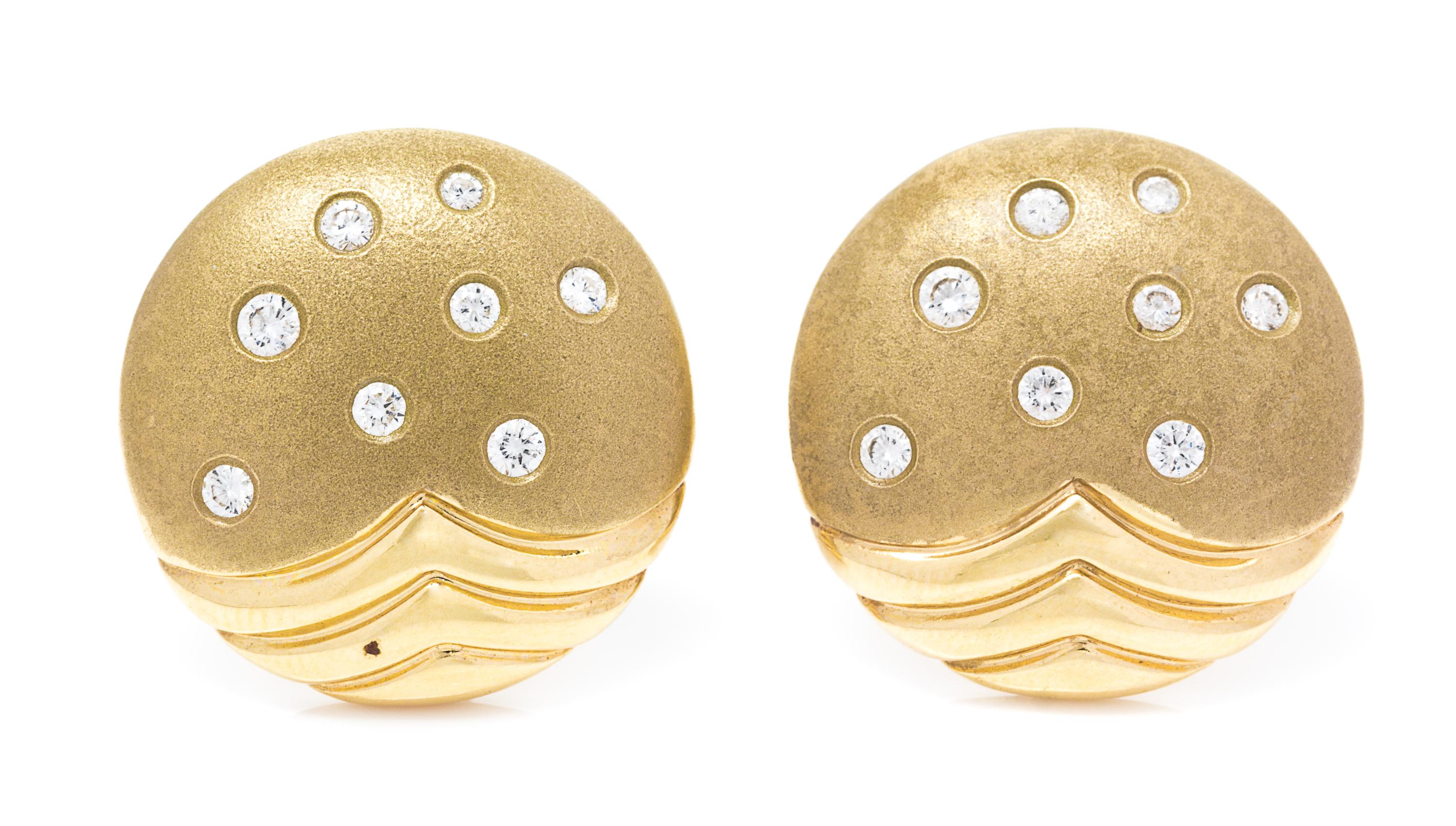 A Pair of 14 Karat Yellow Gold and Diamond Earclips, 8.80 dwts.