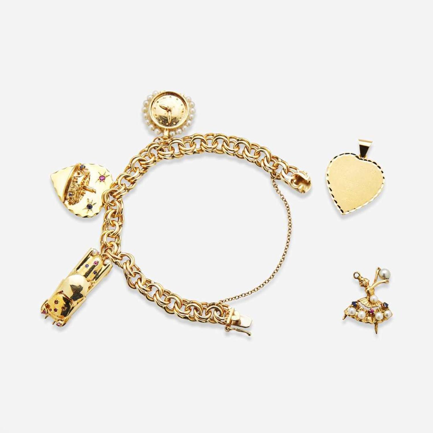 A 14K Yellow Gold Charm Bracelet with 14K Yellow Gold and Gemstone Charms