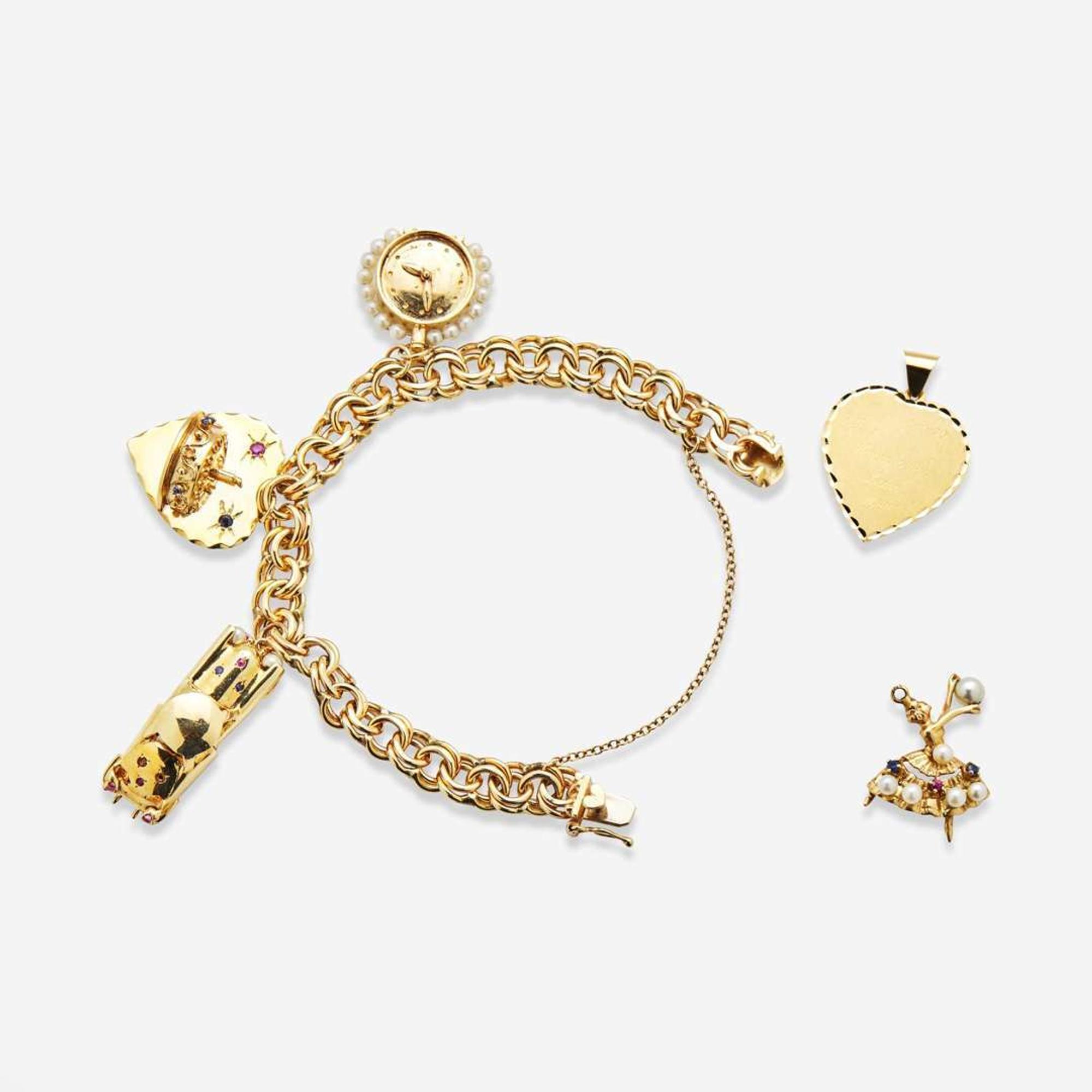 A 14K Yellow Gold Charm Bracelet with 14K Yellow Gold and Gemstone Charms