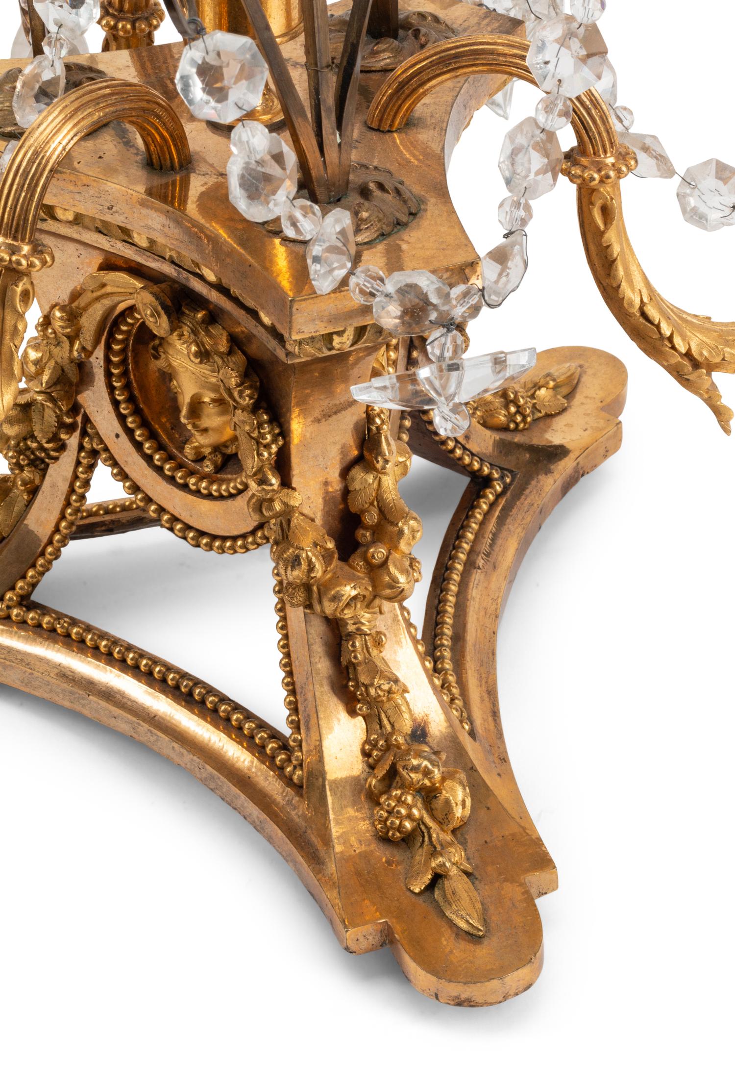 A Pair of French Gilt Bronze, Cut Glass and Rock Crystal Three-Light Candelabra
