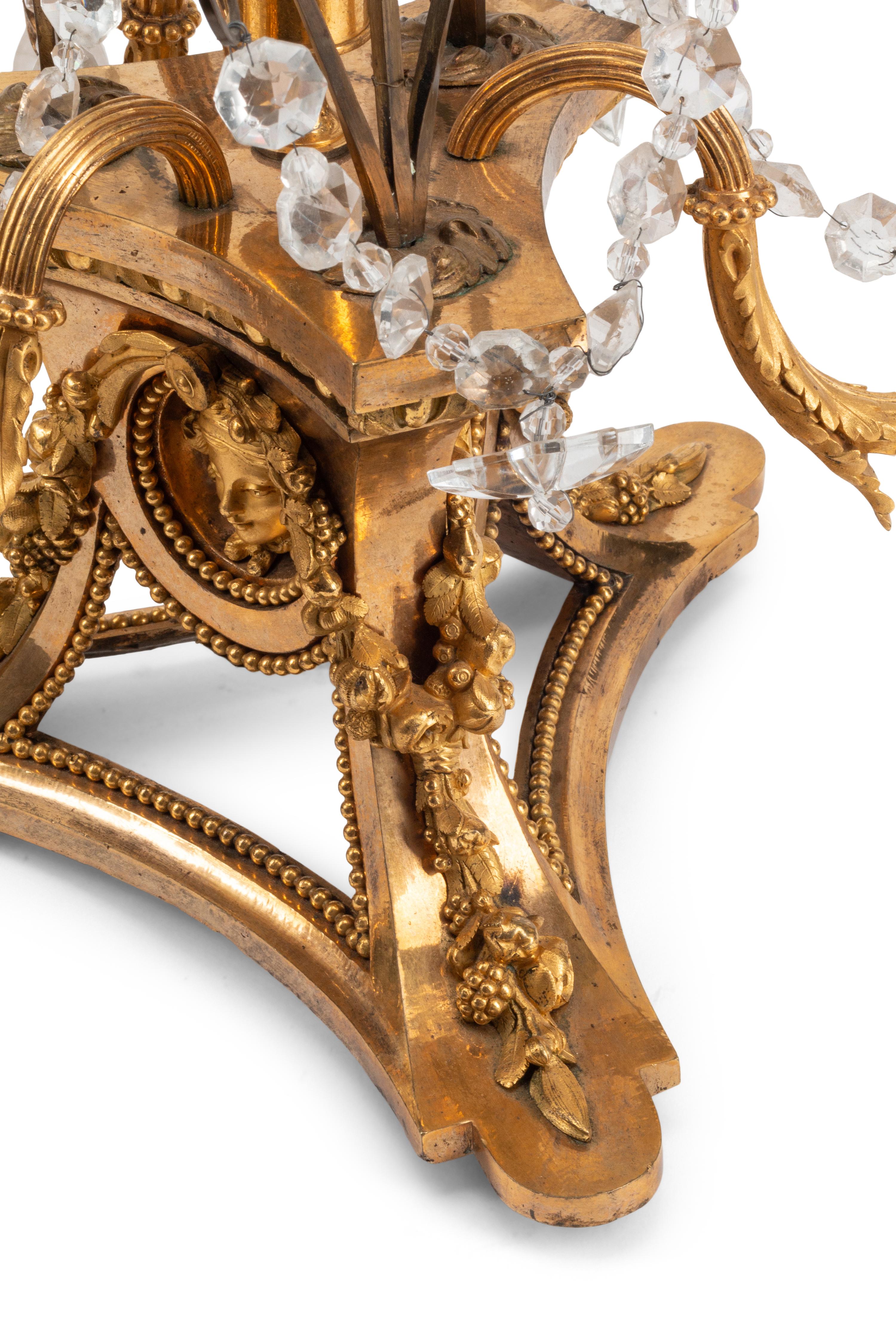 A Pair of French Gilt Bronze, Cut Glass and Rock Crystal Three-Light Candelabra