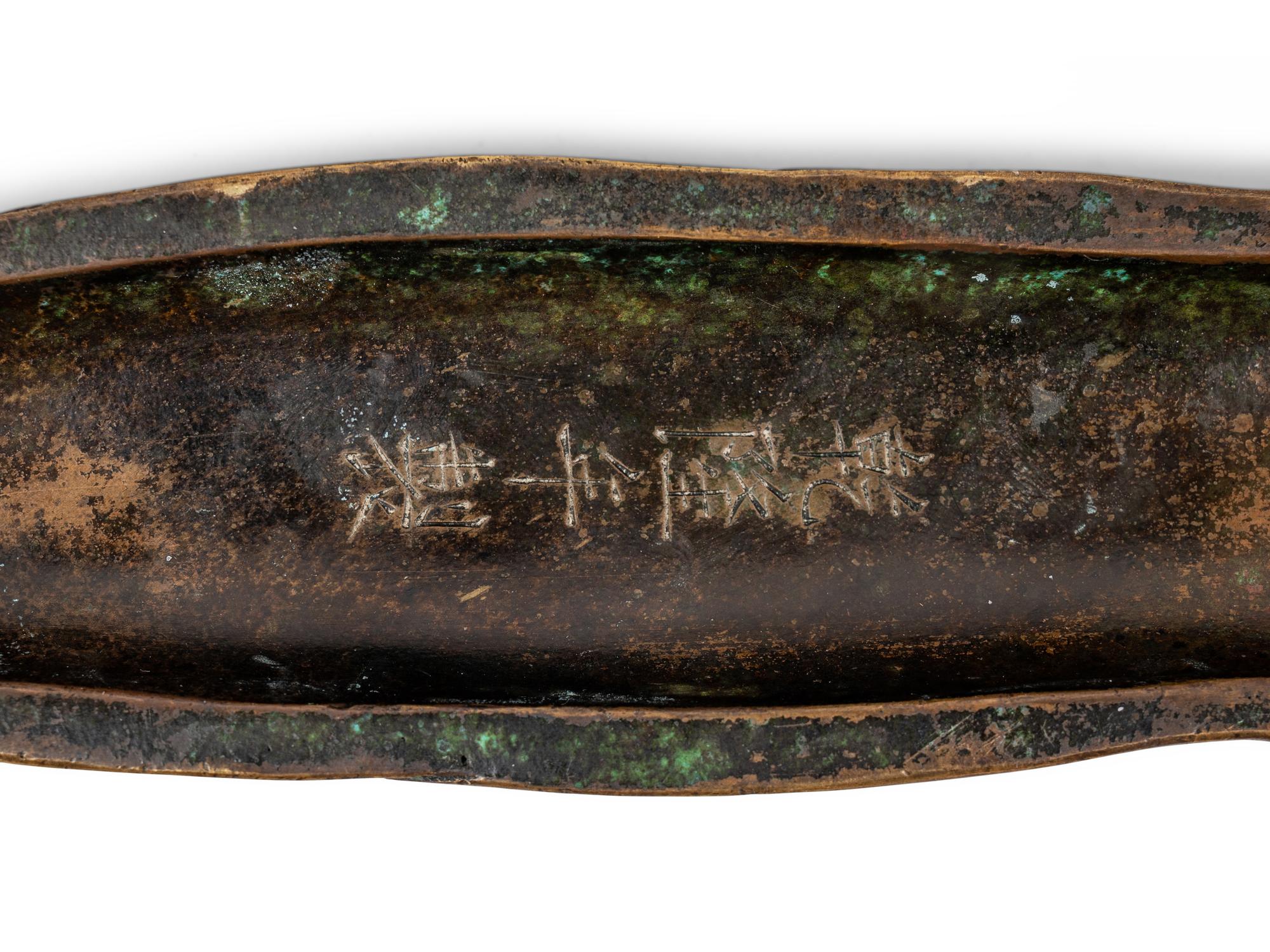 A Chinese Inlaid Bronze Bamboo Shoot-Form Paper Weight