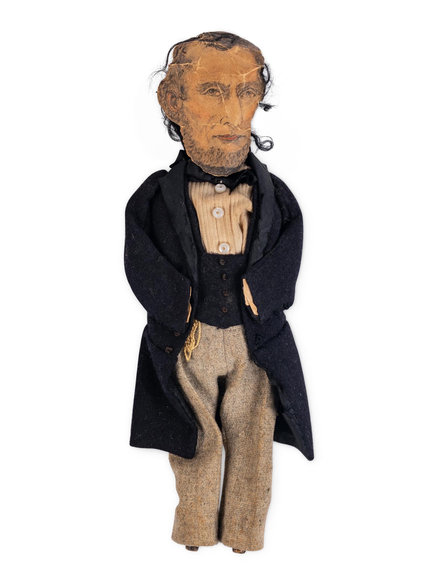 [LINCOLN-JOHNSON CAMPAIGN]. A folk art doll of Abraham Lincoln in long frock coat, ca. 1864.