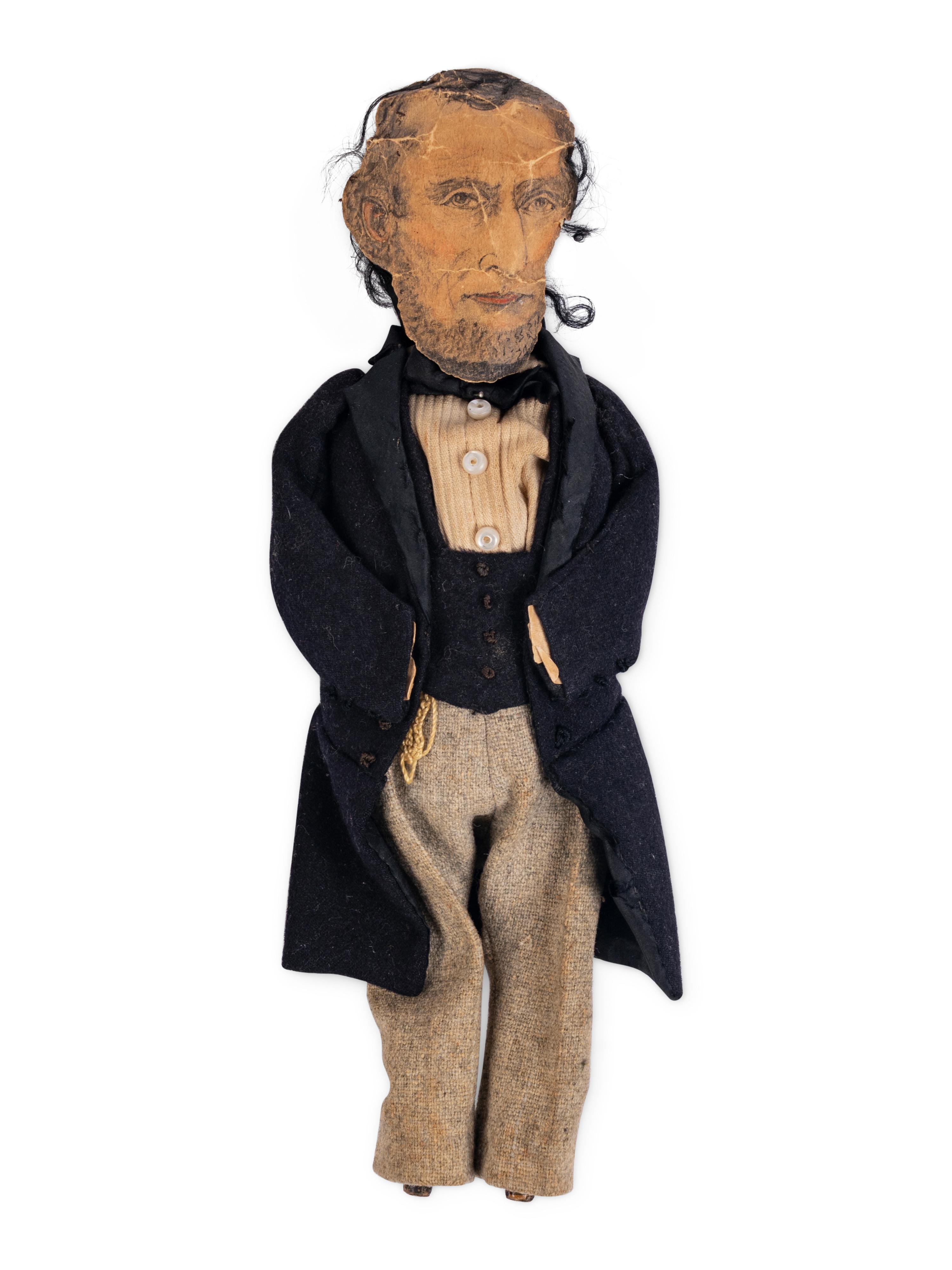 [LINCOLN-JOHNSON CAMPAIGN]. A folk art doll of Abraham Lincoln in long frock coat, ca. 1864.