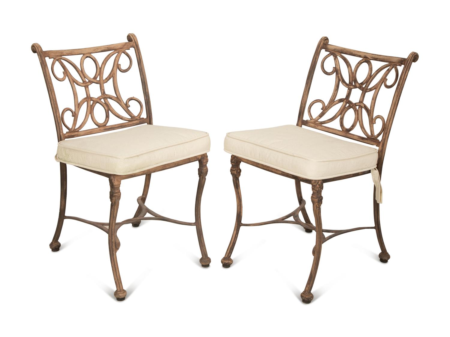 A Pair of Patinated Metal Garden Chairs and Side Table