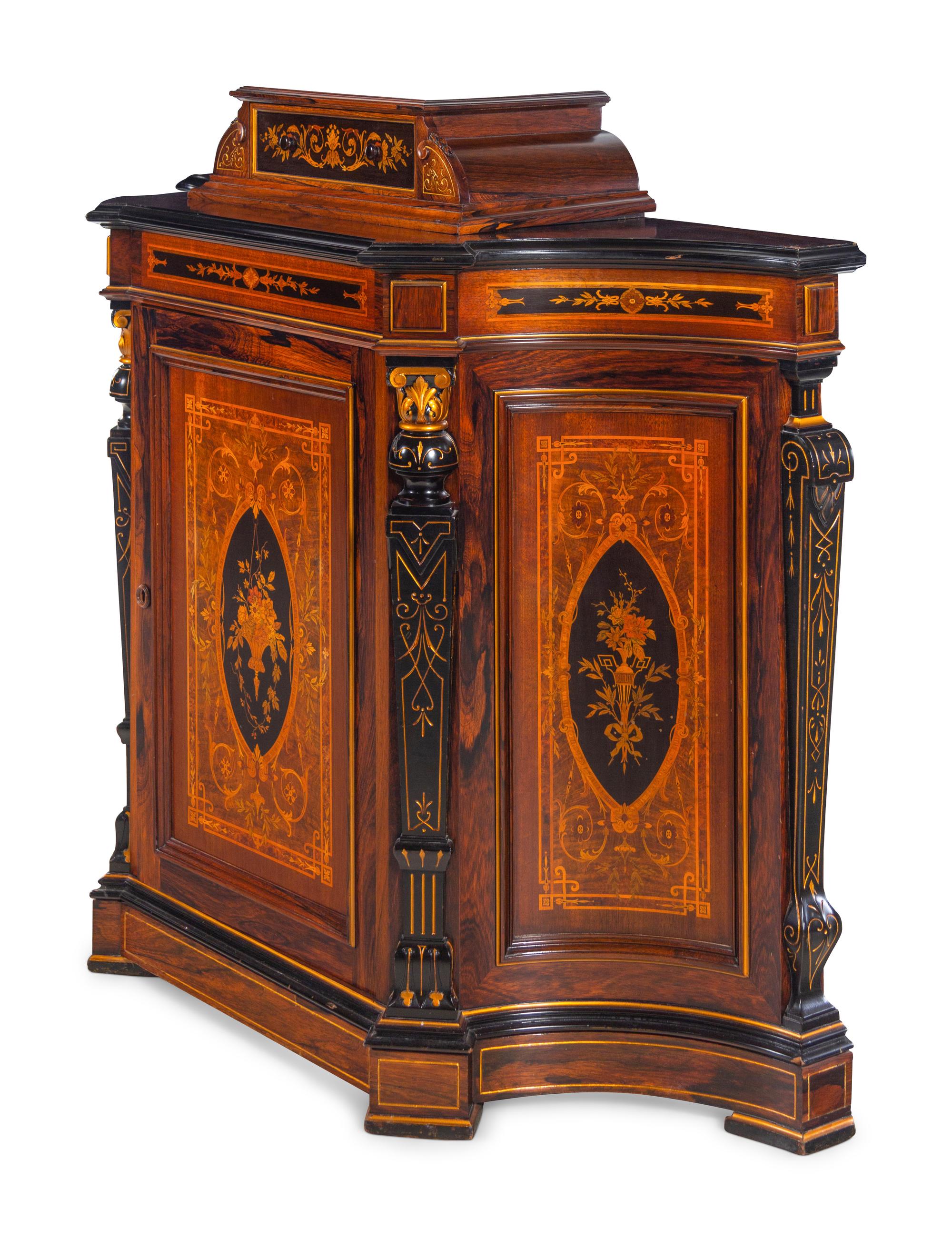 A Victorian Parcel Gilt, Ebonized and Inlaid Rosewood Parlor Cabinet