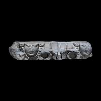 A Roman Marble Frieze Fragment with Heads of Medusa