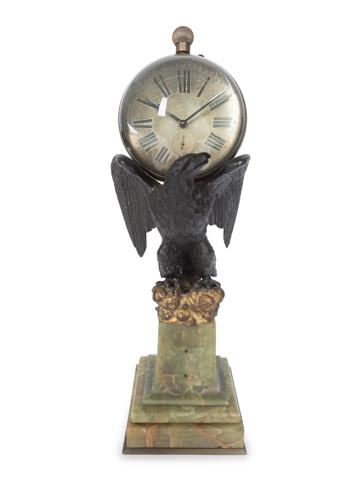 A Continental Gilt and Patinated Bronze and Onyx Clock