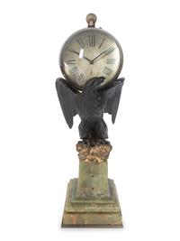 A Continental Gilt and Patinated Bronze and Onyx Clock