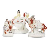 A large collection of seated Staffordshire dog figures 19th/20th centuries