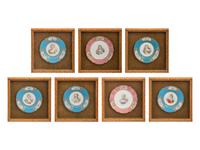 A Group of Seven Framed Sèvres Style Porcelain Plates
