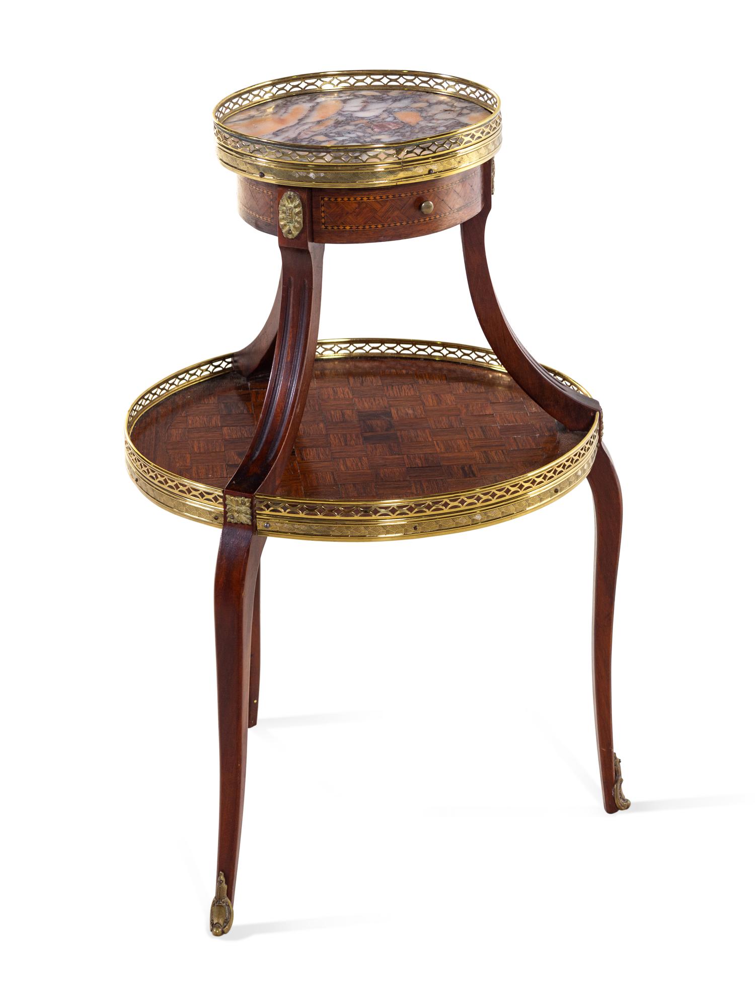 A Louis XV/XVI Two Tiered Mahogany Table