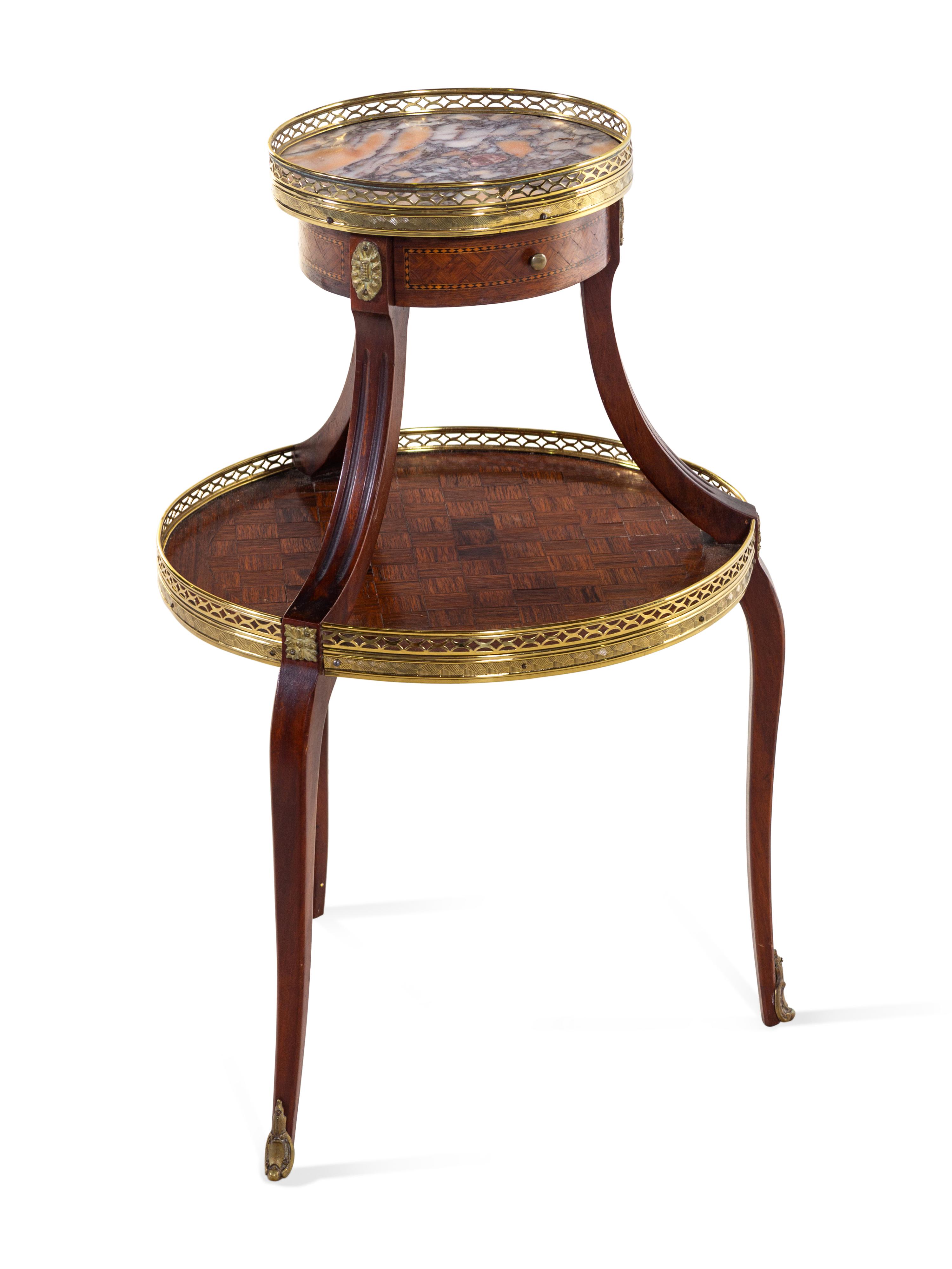A Louis XV/XVI Two Tiered Mahogany Table