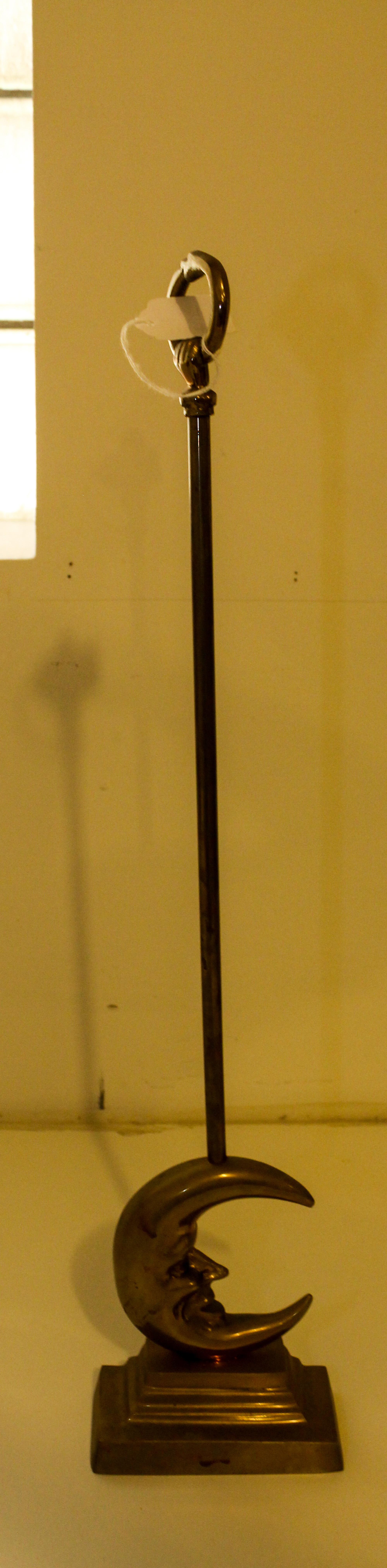 A Gilt Metal Doorstop Height 24 inches.