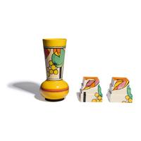 Clarice Cliff (English, 1899-1972) — Apples pattern Vase and two Candlesticks, c. 1931-32