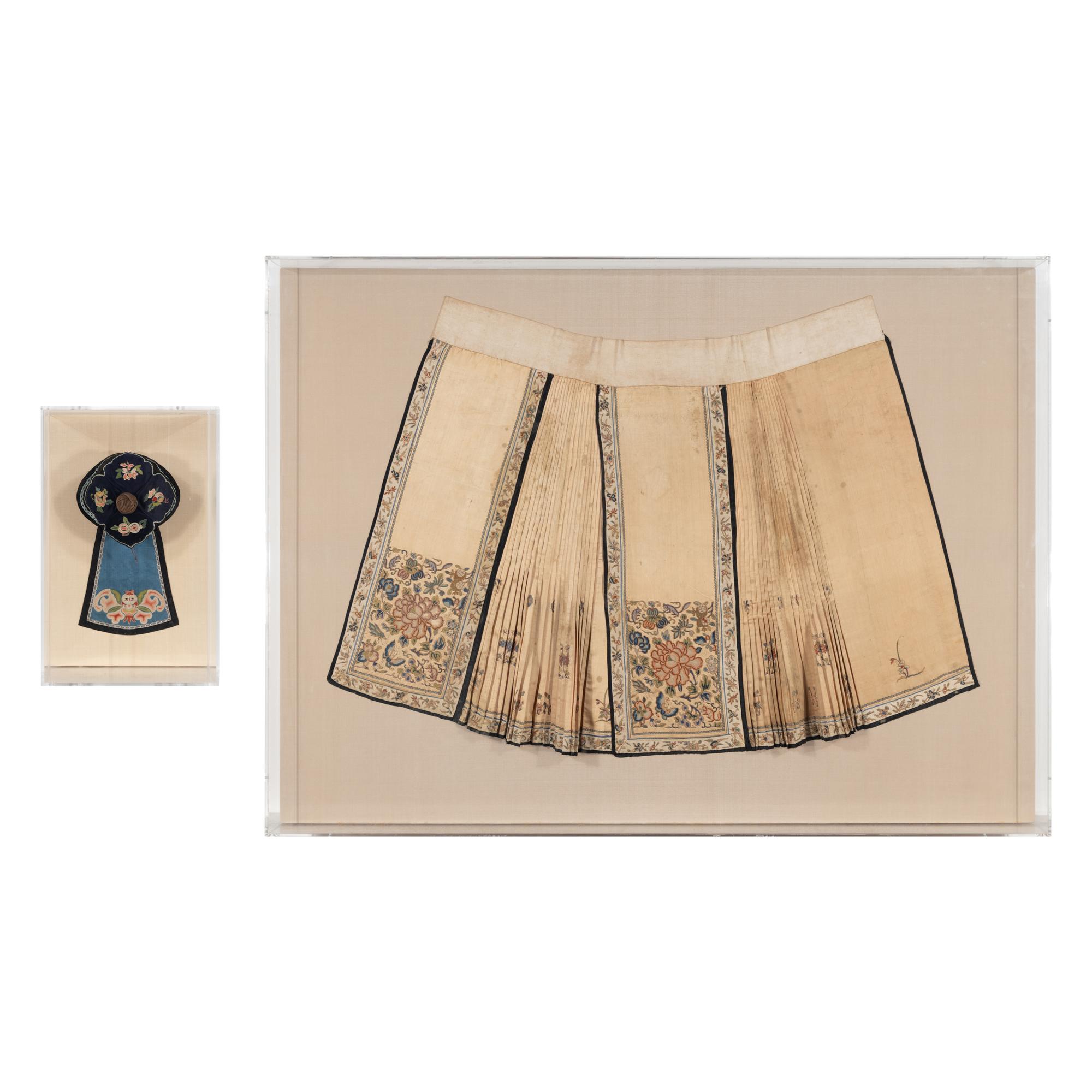 A Chinese Apricot Ground Embroidered Silk Apron Skirt and A Blue Ground Embroidered Silk Hat, 19th Century — 晚清 杏色地繡牡丹紋馬面裙及藍底繡瓜果紋帽