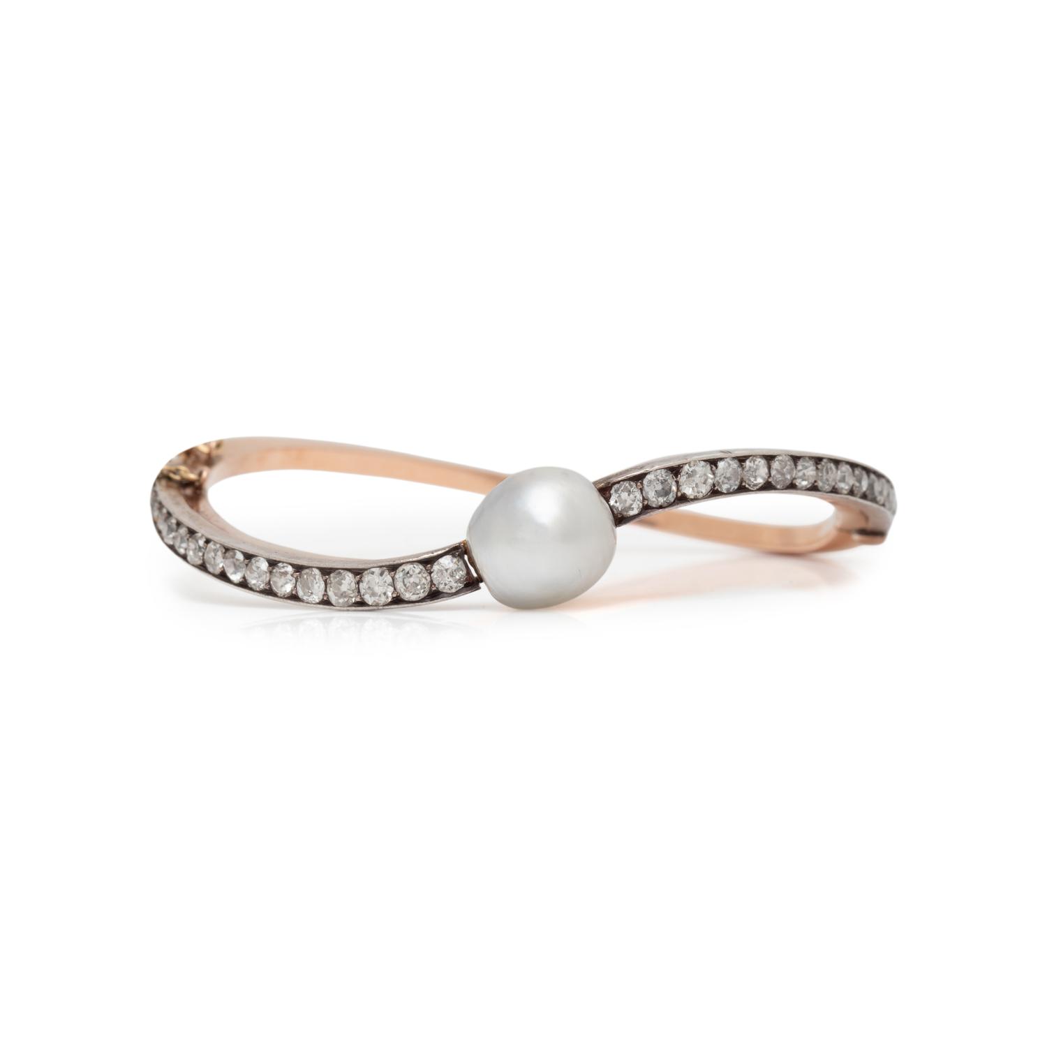 EDWARDIAN, NATURAL PEARL AND DIAMOND BANGLE BRACELET
