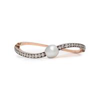 EDWARDIAN, NATURAL PEARL AND DIAMOND BANGLE BRACELET