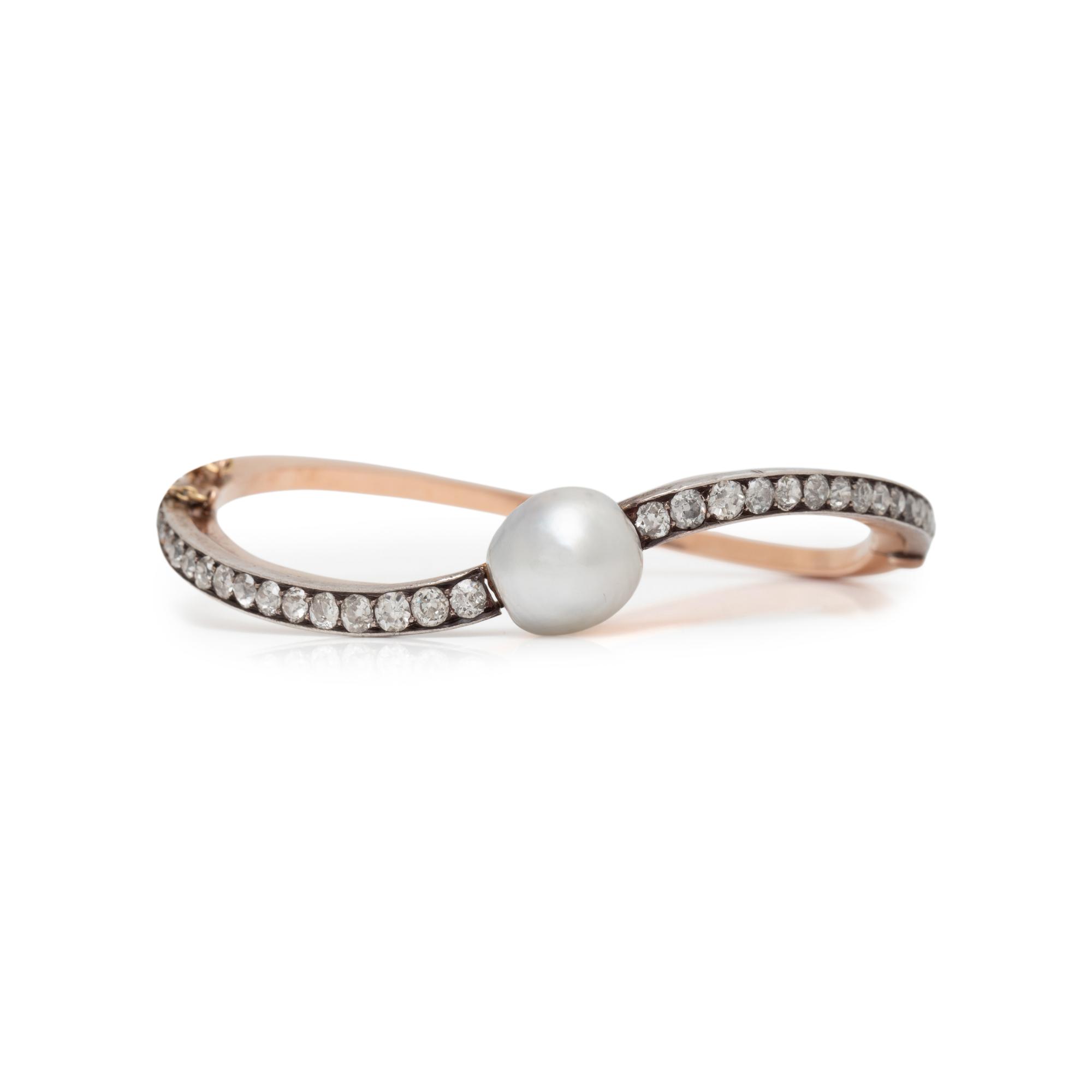 EDWARDIAN, NATURAL PEARL AND DIAMOND BANGLE BRACELET