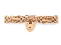 A Nine Karat Rose Gold English Gate Bracelet,