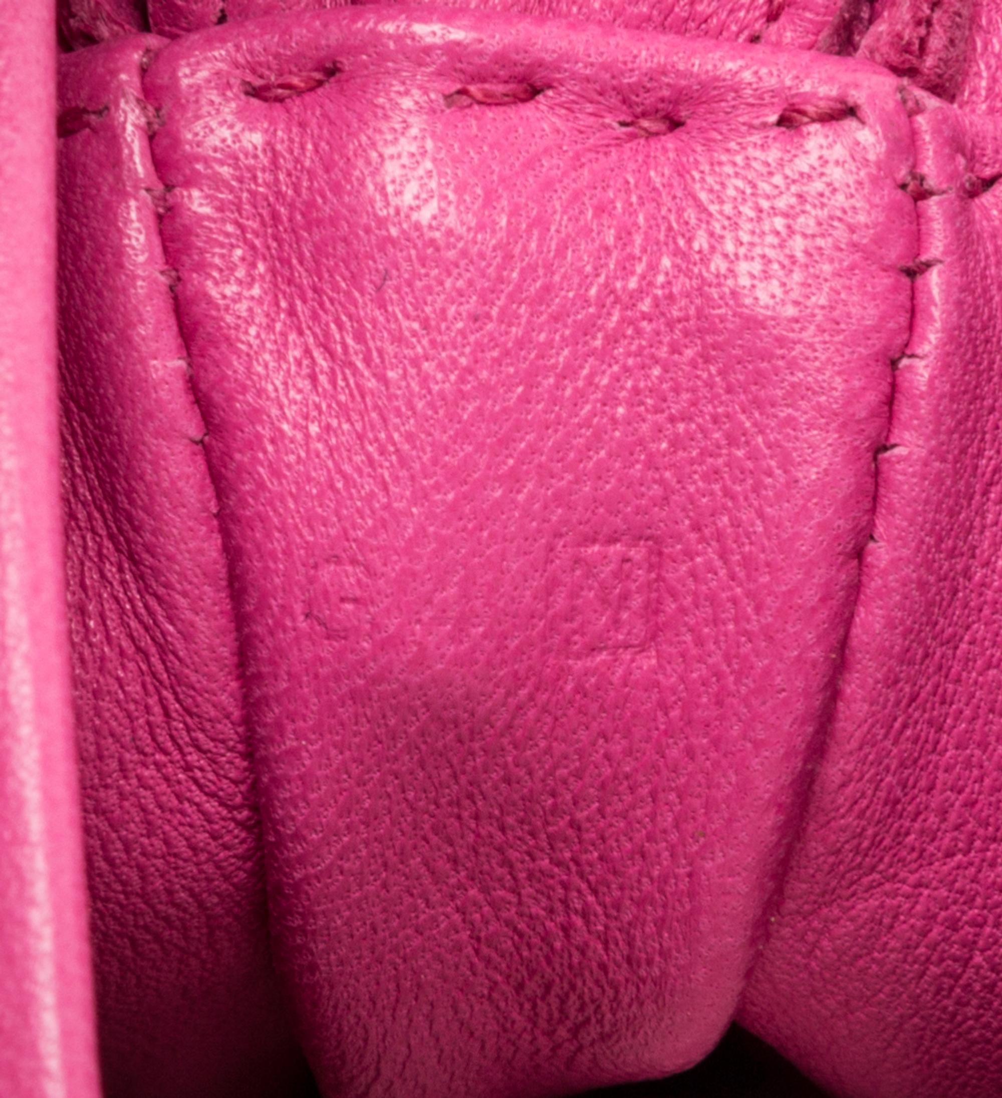 An Hermes Rose Tyrien Agneau Clou de Selle Pouch, 6" x 9" x 1".