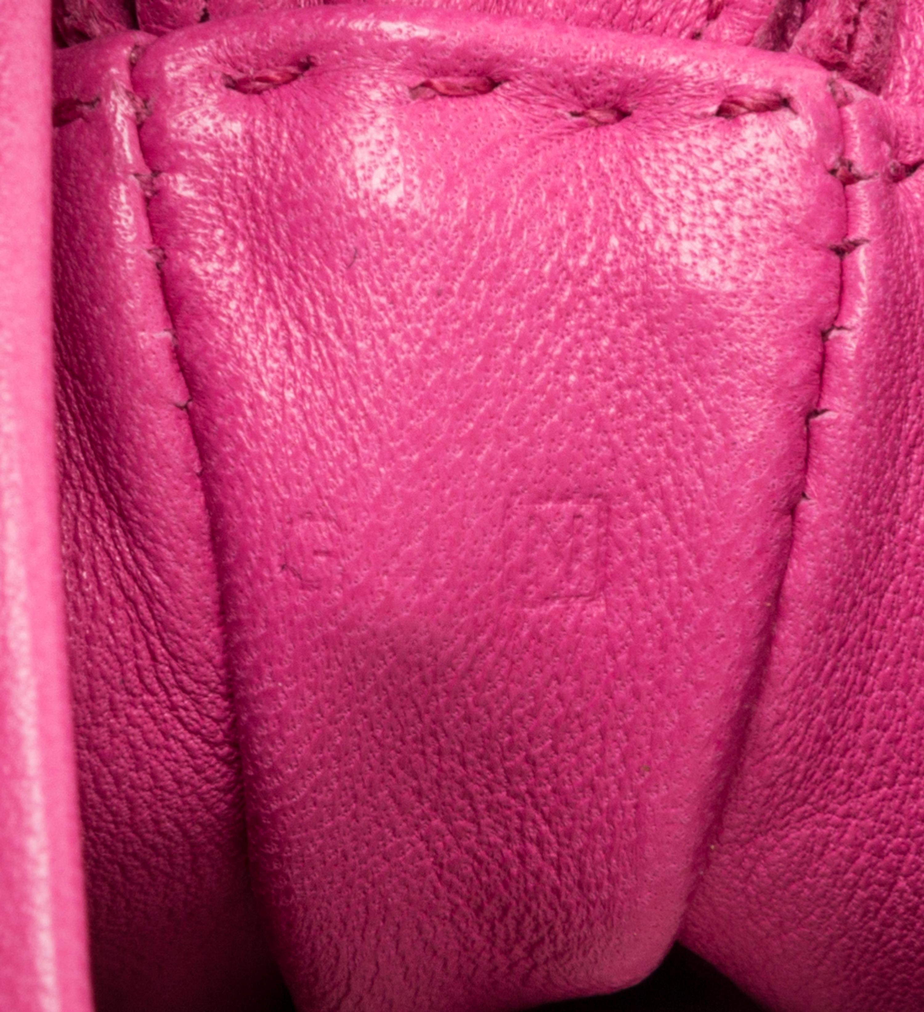 An Hermes Rose Tyrien Agneau Clou de Selle Pouch, 6" x 9" x 1".