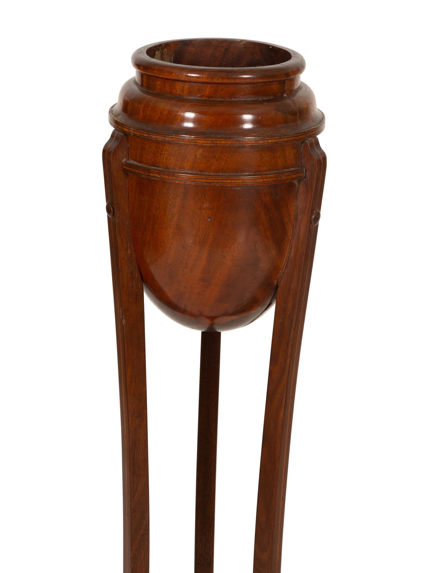 A Pair of George III Style Mahogany Urn Form Jardinière Stands