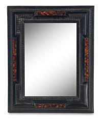 A Flemish Faux Tortoiseshell and Ebonized Ripple-Molded Mirror