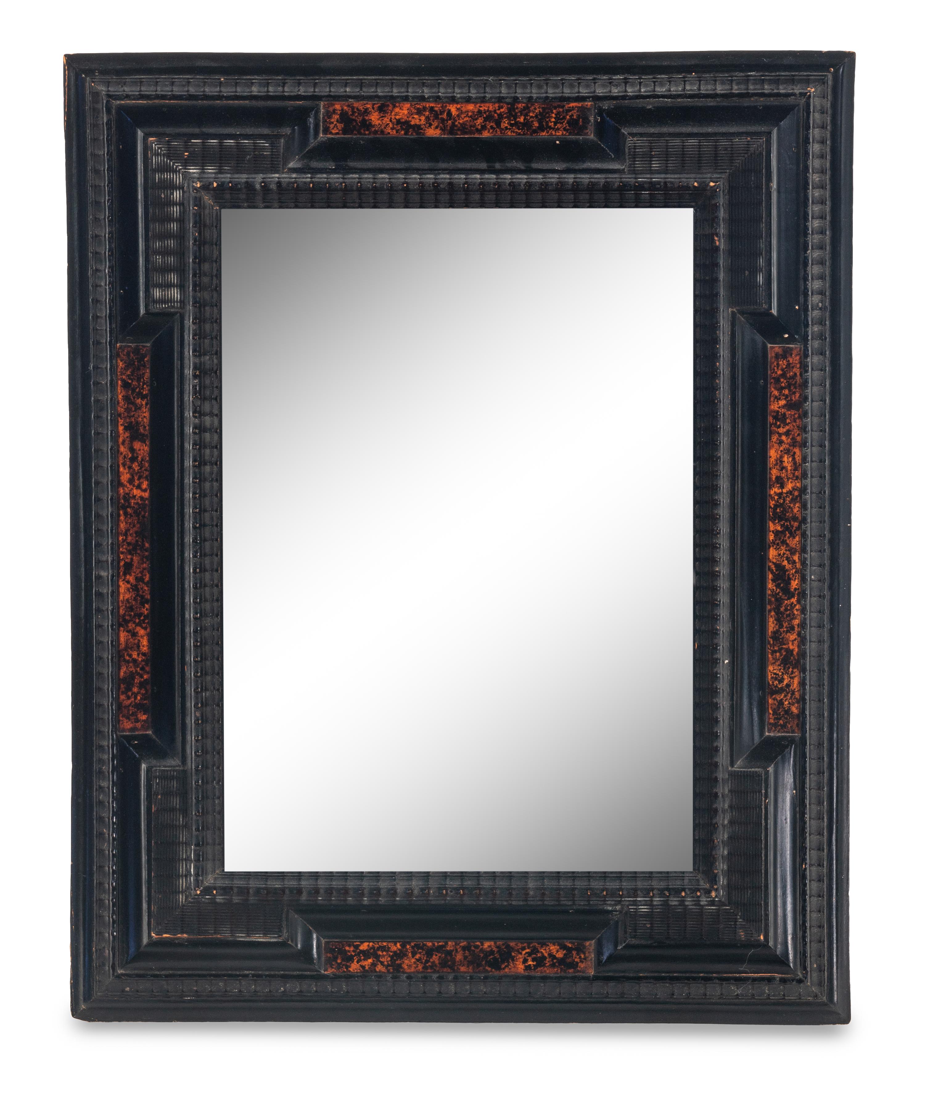 A Flemish Faux Tortoiseshell and Ebonized Ripple-Molded Mirror